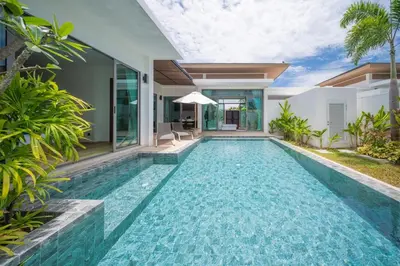 a swimming pool in the backyard of a villa at 2BR Pool Villa at Shambhala in Laguna Bangtao in Bang Tao Beach