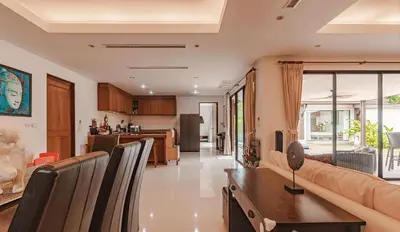 a living room with a couch and a table at 4 BR Jacuzzi Pool Villa with Playground, near Layan, Laguna, Bang Tao beach in Ban Pak Lak