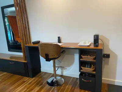 a desk with a chair and a mirror at Rawai Title 3 in Rawai Beach