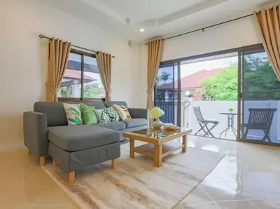 a living room with a couch and a table at Wink Garden 3 Bedrooms Bangtao Beach Phuket in Ban Thalat Choeng Thale