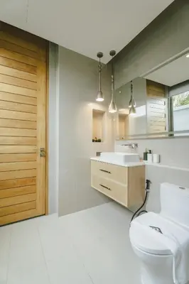 a bathroom with a toilet and a sink at Teak 5 BR Pool Villa Bang Tao Airport Shuttle in Laguna Phuket