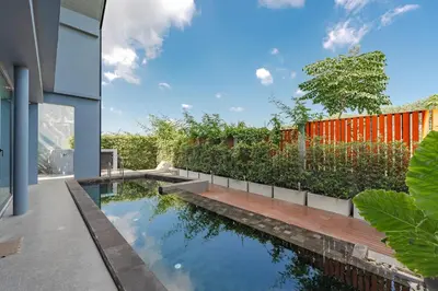 a swimming pool in the backyard of a house at V188 The Granary Loft Haven 3BR Pool Sanctuary in Bang Tao Beach