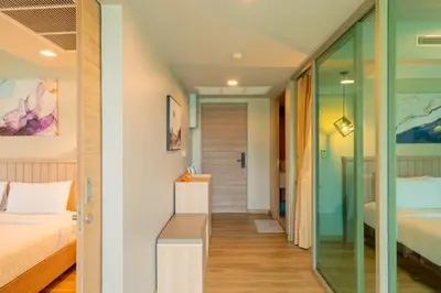 a room with a bed and a glass corridor at Breathtaking Sea & Mountain View Private Pool in Karon Beach