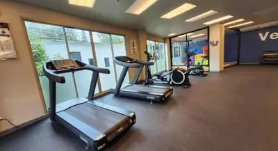 a gym with three tread machines in a room at Breathtaking Sea & Mountain View Private Pool in Karon Beach