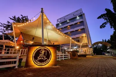 a tent in front of a building at night at Nora Bukit Hotel in Ban Sam Kong