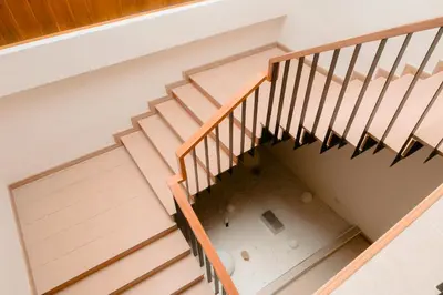 an overhead view of a wooden staircase with a floor at Baan Cocoa Boutique Hotel in Natai Beach