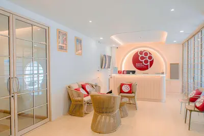 a living room with chairs and a table in a room at Baan Cocoa Boutique Hotel in Natai Beach