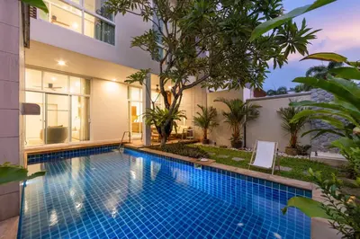a swimming pool in the backyard of a house at Oxygen Villas with Private Pool Near Naiharn by TropicLook in Rawai Beach