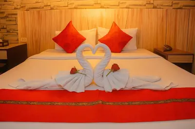 two swans made to look like hearts sitting on a bed at Bellevue Ocean Patong in Patong Beach
