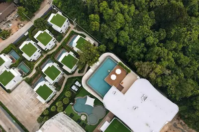 an aerial view of a house with a pool at Duplex in NaiHarn Residence near the Beach, UTL B325 in Rawai Beach