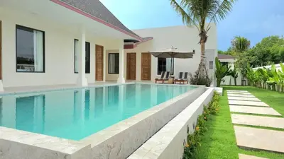 a swimming pool in the backyard of a villa at Dutch Villas Phuket in Koh Lone