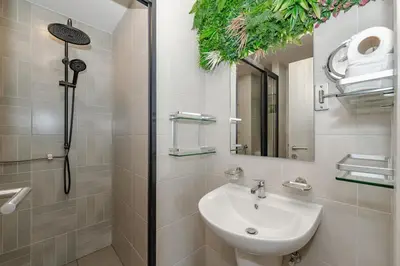 a bathroom with a sink and a shower at C175 Stylish Condo with Pool View D Condo Phuket in Kathu