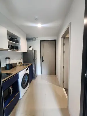 a kitchen with a washer and dryer in it at The Base Central Phuket-B20W in Ban Rangeng