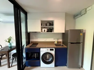 a kitchen with a washing machine and a washer at The Base Central Phuket-B20W in Ban Rangeng