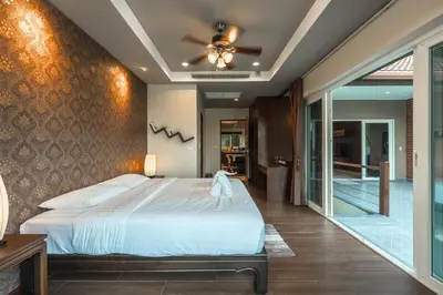 a bedroom with a bed and a ceiling fan at V269 Yamu Sunset Villa 3BR Sea View Pool Retreat in Ban Bang La