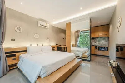 a bedroom with a large bed and a large mirror at C179 Serene and Stylish Getaway in Kamala, Phuket in Kamala Beach