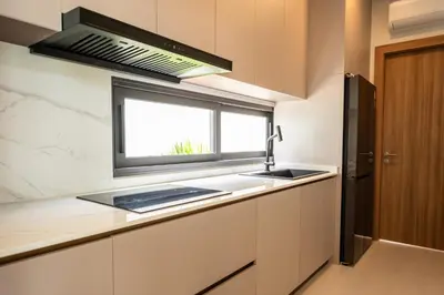 a kitchen with a sink and a window at Mouana Breeze Mai Khao 4-bedroom Pool Villa 9922 in Mai Khao Beach