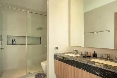 a bathroom with a toilet and a sink and a shower at Mouana Breeze Mai Khao 4-bedroom Pool Villa 9922 in Mai Khao Beach