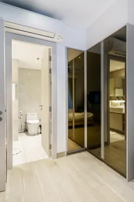 a bathroom with sliding glass doors and a toilet at Lux 2Bdr Cassia Laguna With Own Large Terrace in Laguna Phuket