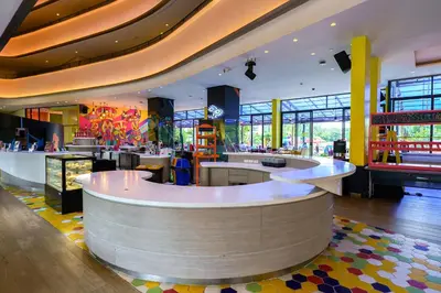 a restaurant with a circular counter in the middle at Lux 2Bdr Cassia Laguna With Own Large Terrace in Laguna Phuket