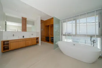 a large bathroom with a large tub and a sink at The Trinity new modern 5BR villa with 20M Pool in Thalang