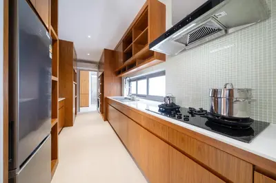 a kitchen with a stove and a sink at The Trinity new modern 5BR villa with 20M Pool in Thalang