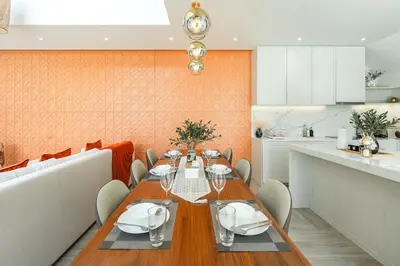 a dining room with a table and a kitchen at V185 New Modern Villa with Private Pool in Bang Tao Beach