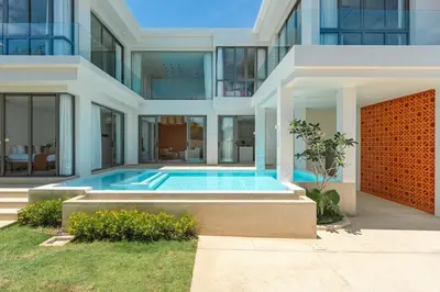 a house with a swimming pool in front of it at V185 New Modern Villa with Private Pool in Bang Tao Beach