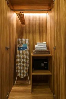 a towel rack in a room with a closet at Perfect Studio 3 pools Nai Harn in Rawai Beach