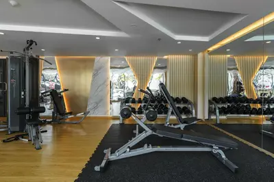 a gym with a treadmill and exercise equipment in it at Perfect Studio 3 pools Nai Harn in Rawai Beach