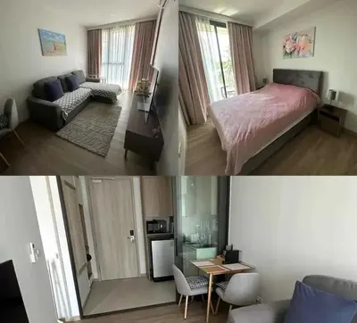 a bedroom and a living room with a bed and a table at Аппартаменты Sky Park Laguna Phuket in Bang Tao Beach