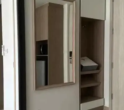 a medicine cabinet with a mirror on a wall at Аппартаменты Sky Park Laguna Phuket in Bang Tao Beach