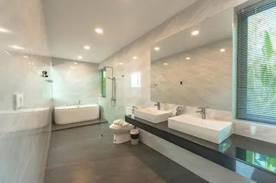 a bathroom with two sinks and a tub and a toilet at V189 Stylish 3BR Hideaway Pool & Beach Vibes in Rawai Beach