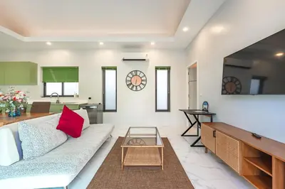 a living room with a couch and a table at V189 Stylish 3BR Hideaway Pool & Beach Vibes in Rawai Beach