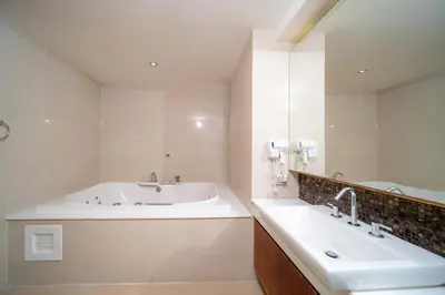 a bathroom with a tub and a sink at Patong private spacious apart-ment 2 minutes walk to the beach bathtub sea view swimming pool in Patong Beach