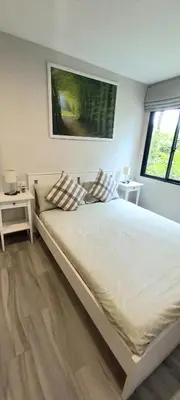 a large bed in a bedroom with two tables at B8 Ватсап669З5В2I976 in Nai Yang Beach