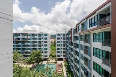 an aerial view of two apartment buildings and a courtyard at C185 Centrio 2BR Condo Walk to Mall Near Town in Phuket Town