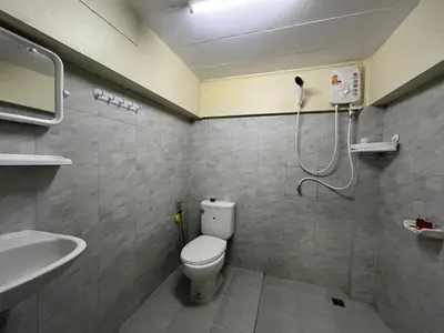 a bathroom with a shower and a toilet and a sink at ANK Residence Patong in Patong Beach
