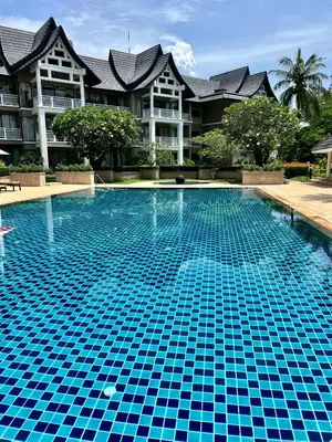 a swimming pool in front of a building at Allamanda 3 Laguna Phuket by Star in Laguna Phuket