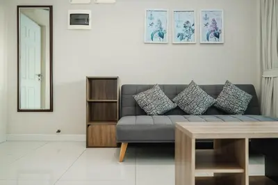 a living room with a couch and a table at C195 Romantic 1BR Ocean Views Cozy & Bright in Kata Beach