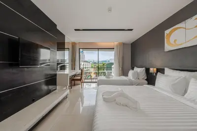 a hotel room with two beds and a balcony at C197 Condo 1BR with Pool 3 Min Walk to Beach in Patong Beach