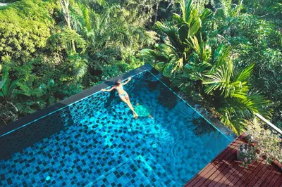 a person is jumping into a swimming pool at Villa Lydia, Koh Yao Noi in Ko Yao Noi