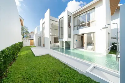 an exterior view of a house with a swimming pool at LuxPride 4BR Spacious Pool Villa for Group and Families in Ban Pak Lak
