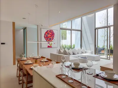 a kitchen and living room with a table and chairs at Tropical Living in Private Pool 3BR Villa in New Residence LuxPride 4 L9 in Bang Tao Beach
