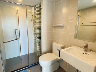 a bathroom with a toilet and a sink and a shower at Vista Old Town Phuket in Phuket Town