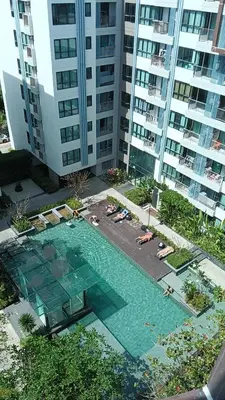 an overhead view of a swimming pool in front of a building at Centrio 2 bed rooms in Phuket Town