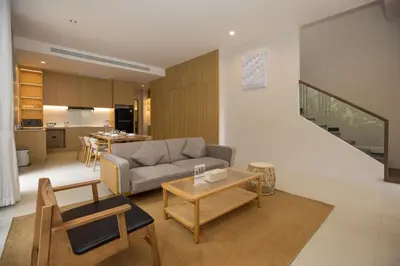 a living room with a couch and a table at Chalong Bay View 3BR Pool Villa Long One B10 in Chalong
