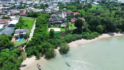 an aerial view of a beach with boats in the water at Phu-Pha Thara Villa Phuket in Ban Saiyuan (1)