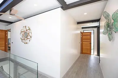 a hallway with white walls and a glass floor at New 2-Storey Villa Sunset Garden 8 with 4BR & Eco-Pool, near Naiharn in Rawai Beach