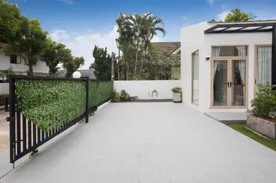 a driveway of a house with a fence at Your Tropical Island Home - New & Modern 2BR Pool Villa Seamate in Chalong